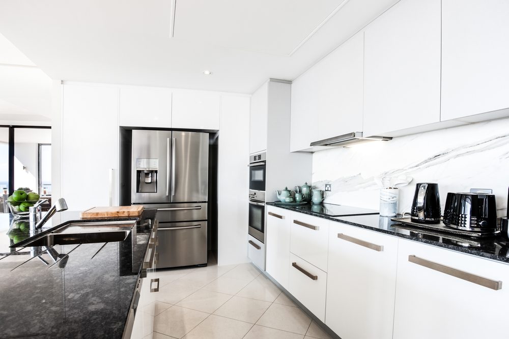 Modern galley style kitchen in white